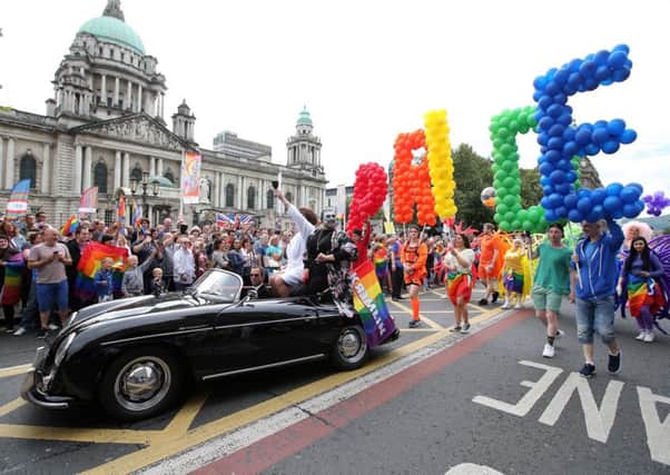 Last year's Gay Pride parade passes in front of Belfast City Hall