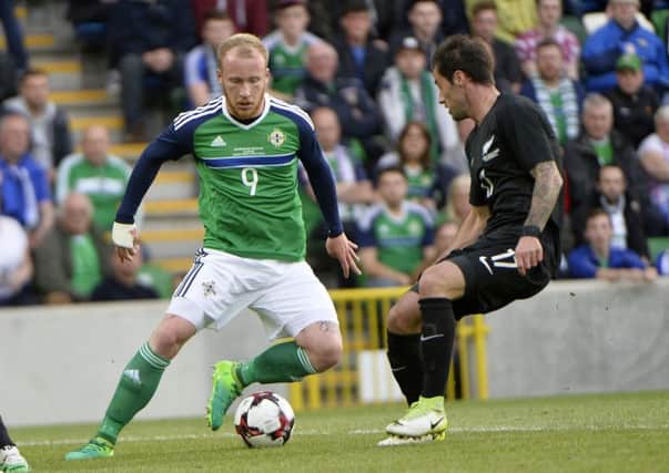Northern Irelands Liam Boyce in action with New Zealands Tom Doyle