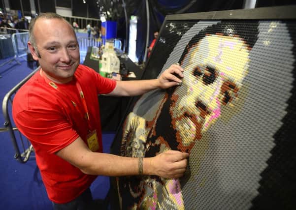 Mark Byrne with his LEGO mosaic of  UFC champ Conor McGregor. 
Picture By: Arthur Allison.