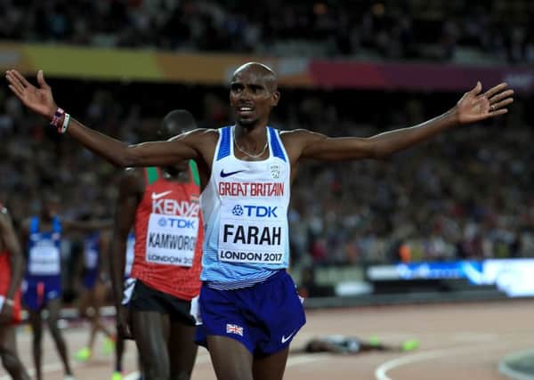 Great Britain's Mo Farah celebrates winning the men's 10,000 metre final