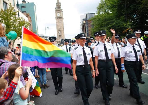Members of the PSNI and Garda join the Pride parade as it makes it's way through Belfast city centre. Photo: PA