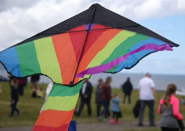A kite bearing rainbow colours flying at the weekend at Downhill Demesne, Co Londonderry, in a National Trust-organised kite flying event
