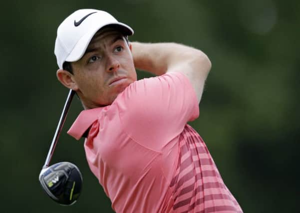 Rory McIlroy, from Northern Ireland, tees off on the third hole during the third round