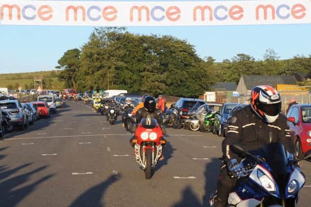 The convoy of riders pictured arriving at the UGP paddock after completing a lap of the world famous Dundrod circuit. Pic by John Kelly