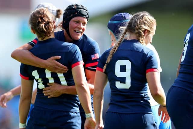USA's Sylvia Braaten celebrates with Kimber Rozier after she scored a try against Italy