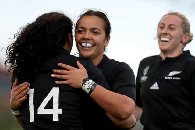 New Zealands Portia Woodman celebrates scoring a try against Wales