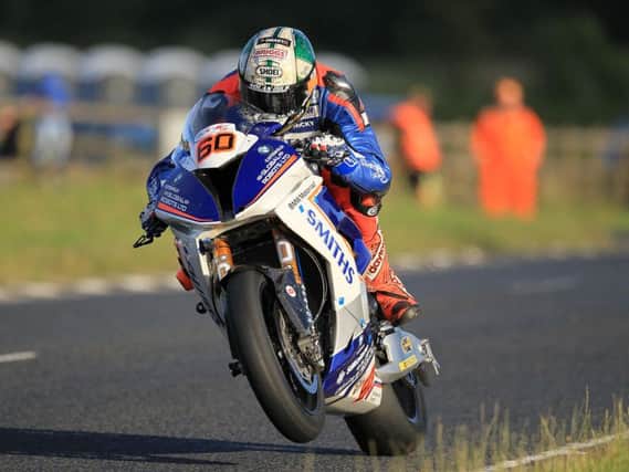 Peter Hickman set the fastest ever qualifying lap at Dundrod at 133.560mph to take provisional pole in the Superbike class.