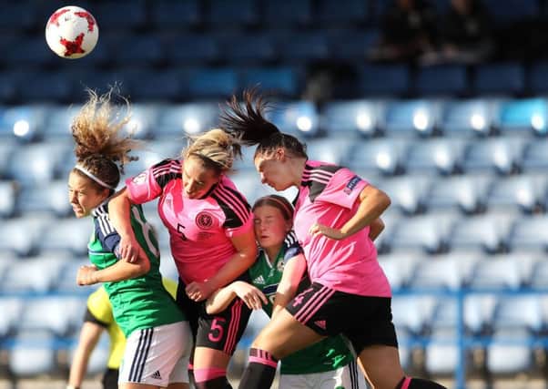 Brenna McPartlan (left) and Emily Wilson (second right) battling with Scotland at Mourneview Park in the 1-1 draw. Pic by PressEye Ltd.