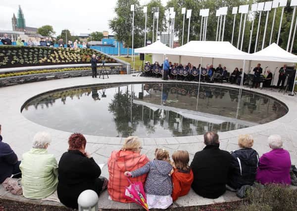 Those taking part in 

16th anniversary remembrance service for the victims of the Omagh bomb at the remembrance gardens in Omagh town centre in 2014. Disappointment has been expressed that police did not send a representative this year for what organisers believe is the first time in 19 years of the annual service.