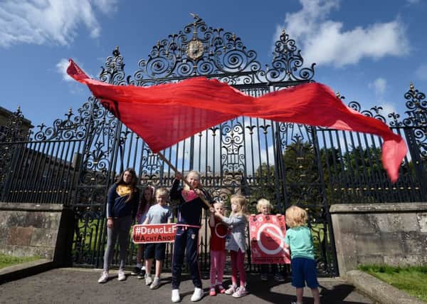 Pacemaker Press 15/8/2017 
Irish Language activists  (An Dream Dearg ) at Hillsborough Castle on Tuesday, Who delivered a letter each for the security of State James Brokenshire, as the seek  a Irish language act to be implemented.
Pic Colm Lenaghan/Pacemaker