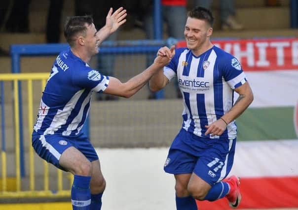 Celebration time following Josh Carson's goal against Cliftonville in victory for Coleraine. Pic by Pacemaker.