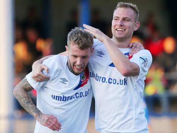 Linfield's Kirk Millar (left) celebrates with team-mate Andrew Mitchell after he scores to make it 2-0 against Ards