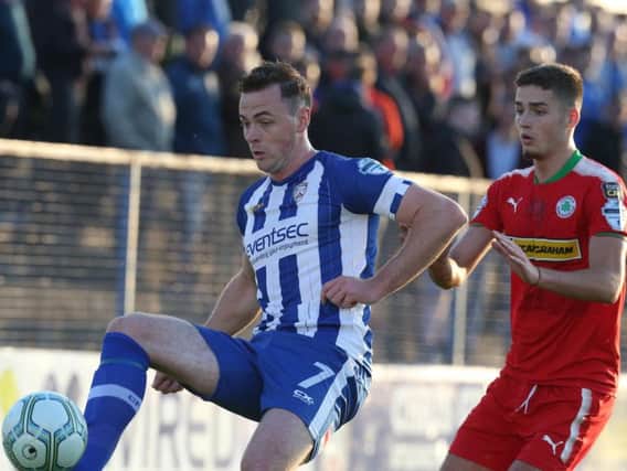 Coleraine's Darren McCauley in action with Cliftonville's Jay Donnelly. Photo: Press Eye