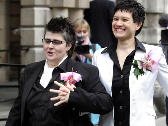 File photo dated 19/12/05 of Shannon Sickles (right) and Grainne Close outside Belfast City Hall after their civil partnership ceremony