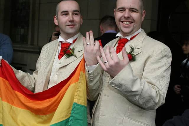 File photo dated 19/12/05 of Henry Edmond Kane (left) and partner Christopher Patrick Flanagan outside Belfast City Hall after their civil partnership ceremony