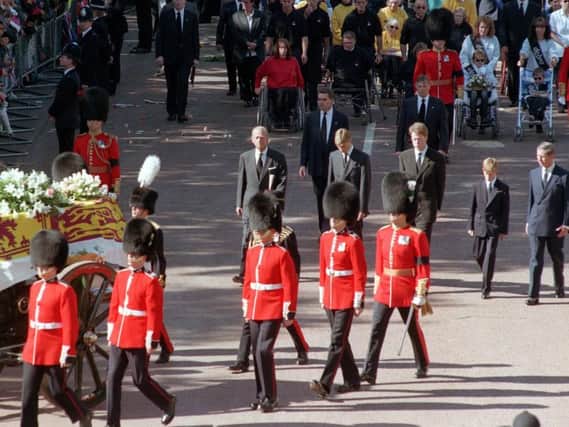 William and Harry walking behind their mother's coffin as they approached Westminster Abbey