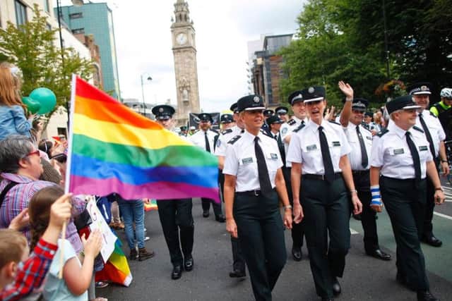 Members of the PSNI and Garda join the Pride parade as it makes its way through Belfast city centre. Photo: PA