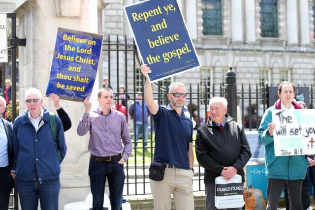 Christian protestors outside Belfast City Hall as thousands of people take part in the annual Belfast Pride event in Belfast city centre earlier this month.

Photo by Kelvin Boyes / Press Eye
