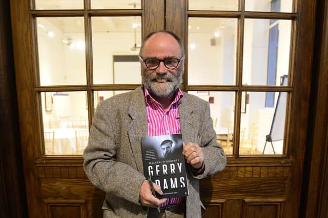 Malachi O'Doherty holds a copy of his book '
Gerry Adams: An Unauthorised Life' at its launch at the Ulster Museum in Belfast on Thursday September 7. Picture by Arthur Allison/Pacemaker Press