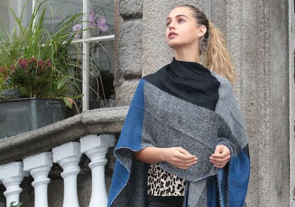 Thalia Heffernan wears Blue and Grey Poncho: 14.99, Blue Jeans: 9.99 and Black Ankle Boots: 24.99 from the Heidi Klum new A/W range for Lidl.
