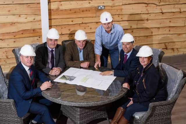 Richard Fry & Gary Hanna reviewing building plans for the new Â£5 million development at Coleman,s Garden Centre with local Councillors, MLA's and the local MP.  Pictured left to right, Councillor Paul Michael, Trevor Clarke MLA South Antrim, Richard Fry, Coleman's Garden Centre, Gary Hanna, May Estates, Paul Girvan MP South Antrim and Pam Cameron MLA South Antrim.