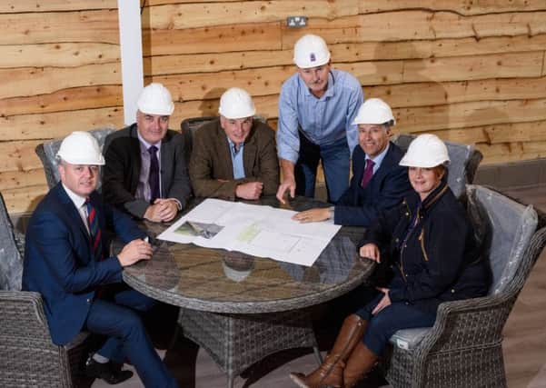 Richard Fry & Gary Hanna reviewing building plans for the new Â£5 million development at Coleman,s Garden Centre with local Councillors, MLA's and the local MP.  Pictured left to right, Councillor Paul Michael, Trevor Clarke MLA South Antrim, Richard Fry, Coleman's Garden Centre, Gary Hanna, May Estates, Paul Girvan MP South Antrim and Pam Cameron MLA South Antrim.