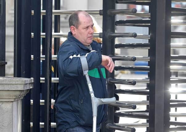 Anthony Fox leaving a hearing concerning his parents' murders at the High Court in 2015