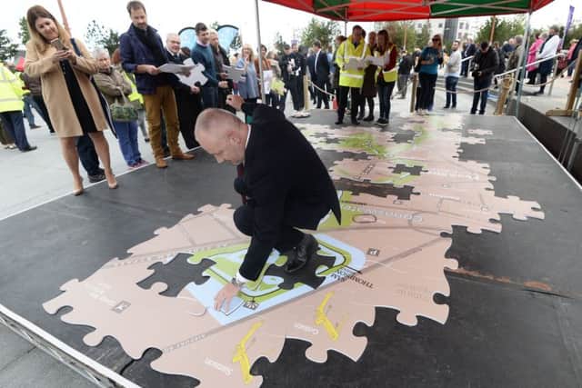 The official opening saw more than 100 people build an outsized jigsaw replicating a map of the Connswater Community Greenway in East Belfast.
 Photo Colm Lenaghan/ Pacemaker Press