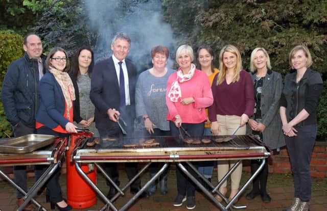 BOIOFW Steering Group members take charge of the BBQ to say thanks to the 2017 participating hosts, left to right, Graeme Campbell (CAFRE Greenmount), Rebecca McConnell (Purple Rain, Project Manager), Kate Cairns (UFU), Chairman Barclay Bell, Linda Davis (Laurel View Farm), Sylvia Matthews (Donagh Cottage Farm), Heather Stewart (UFU), Ashley Morrow (Bank of Ireland), Christine Cousins (Food NI) and Vincenta Leyden (Purple Rain, Schools Co-ordinator).
