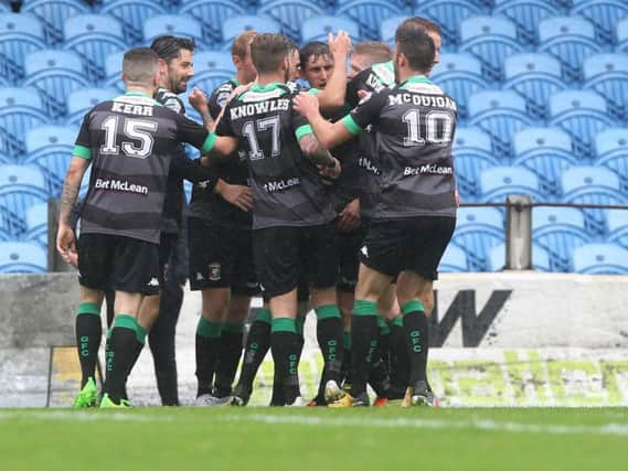 Glentoran's Marcus Kane celebrates with his teammates after putting his side 1-0 ahead in the first half.