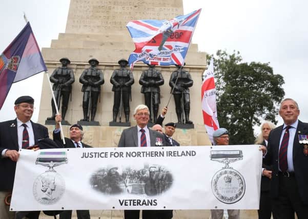 Former British soldier Dennis Hutchings (centre), who has been charged over the fatal 1974 shooting of a man in Northern Ireland, takes part in a protest to call for an end to prosecutions of veterans who served during the Troubles, on Horse Guards Parade, London. Photo credit: Gareth Fuller/PA Wire