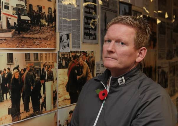 Pictured against photos of the 1987 IRA Poppy Day Bombing, victim Stephen Gault says he has been left 'numb' by the governments refusal to follow the example of America, France and Germany, which all successfully pressed Libya to compensate their citizens for Libyan-sponsored terrorism. Pic: Paul Faith/PA Wire