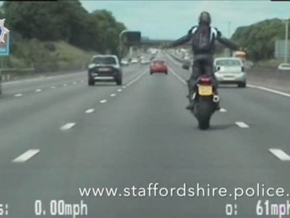 Pawel Zietowski was filmed by an unmarked police patrol for 16 minutes as he repeatedly flouted the rules of the road, steering with his thighs and even rummaging through a backpack to find a mobile phone.
