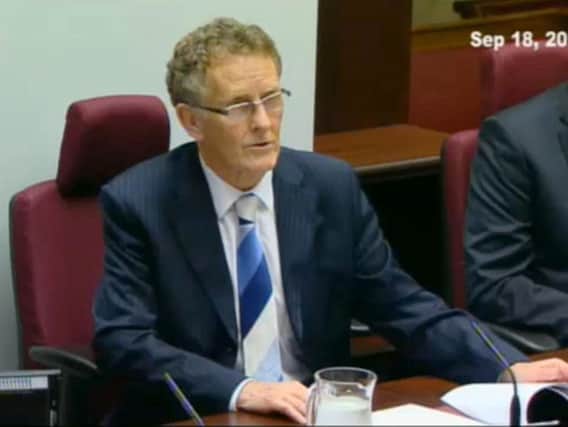 Handout video grab taken from the Renewable Heat Incentive inquiry of the chairman of the Renewable Heat Incentive (RHI) inquiry Sir Patrick Coghlin speaking about the revised timetable at the latest preliminary hearing of the inquiry at Stormont.