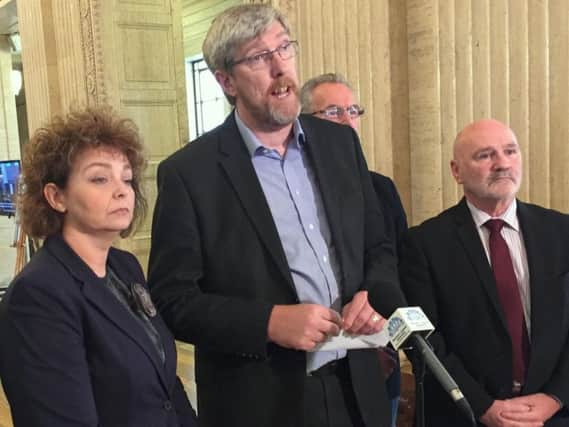 John O'Dowd (centre) speaking to media surrounded by Sinn Fein colleagues in Great Hall of Parliament Buildings, Stormont, Belfast as senior party figure John O'Dowd criticised Mrs Foster's remarks and said she was living in a "fools' paradise" if she thought powersharing could be restored at Stormont without progress on the language question
