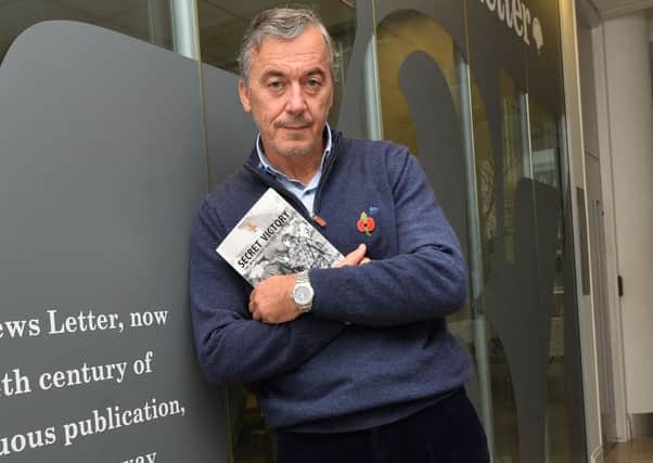 William Matchett at the News Letter's Belfast office with a copy of his book 'Secret Victory: The intelligence war that beat the IRA'.
 Photo Colm Lenaghan/Pacemaker Press