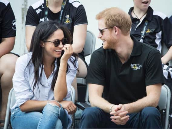 Prince Harry and Meghan Markle watch Wheelchair Tennis at the 2017 Invictus Games in Toronto, Canada