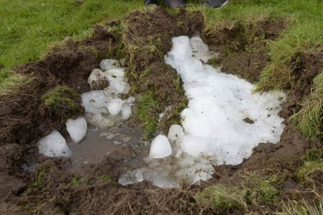 The large block of ice which fell from the sky and crashed into a stunned family's back garden where it has left a massive crater.
