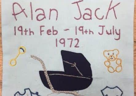 A memorial patch to five-month-old Alan Jack, who died in an IRA car bomb attack in Strabane 1972