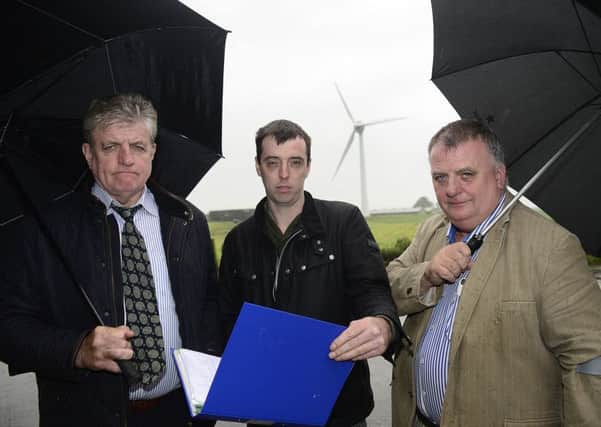 From left to right: Liam McGuckian, Colin Newell and  Barney McGuckian at the Cloughmills site. Picture:  Arthur Allison/Pacemaker Press