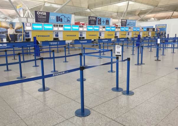 The scene at the Ryanair check-in desks (taken at 14:35 hrs) at London Stansted Airport, Essex. Ryanair has been accused by the aviation regulator of failing to respond to its request to discuss how it is treating passengers whose flights have been cancelled. PRESS ASSOCIATION Photo. Picture date: Friday September 29, 2017. The Civil Aviation Authority (CAA) has told the Dublin-based carrier it has until 5pm on Friday to sort out compensation arrangements for hundreds of thousands of affected travellers or face possible action. See PA story AIR Ryanair. Photo credit should read: John Stillwell/PA Wire