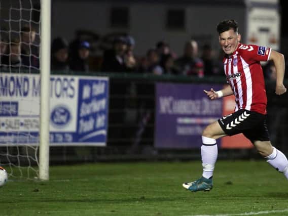 PERFECT START . . . Derry City defender, Conor McDermott turns to celebrate his first senior goal for the club after putting the club ahead against Drogheda United at Maginn Park on Friday night.