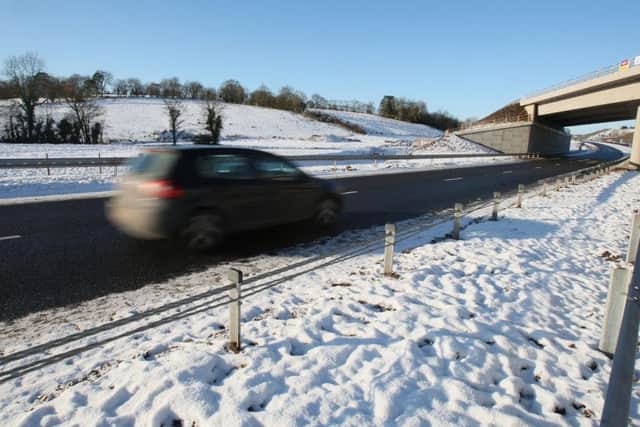 A car travels on the A4 in Co Tyrone after its official opening as a new dual carriageway in December 2010. It is one of three road sections that Ben Lowry says could have been a motorway, funded by tolls, as in the Republic, but there was no political will for such a development. Paul Faith/PA Wire