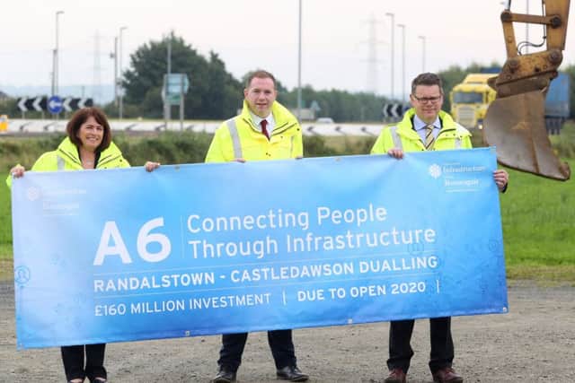 The A6 between Belfast and Londonderry is gradually being runed into expressway, which could ultimately link into an orbital road round Ireland. In this August 2016 image, the Â£160 million Randalstown to Castledawson dualling section is launched. Pictured are Deirdre Mackle Divisional roads manager,  Infrastructure Minister Chris Hazzard and Andrew Hitchenor Strategic Road Improvements Manager.

Photographer Andrew Paton / Press Eye
