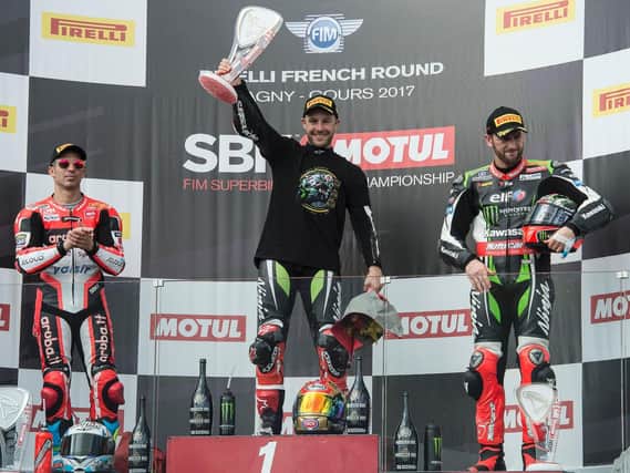 Northern Ireland's Jonathan Rea has made history after winning the World Superbike Championship for the third successive year in France.