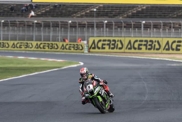 Jonathan Rea was in a class of his own as he won the opening race in the wet at Magny-Cours in France on Saturday.