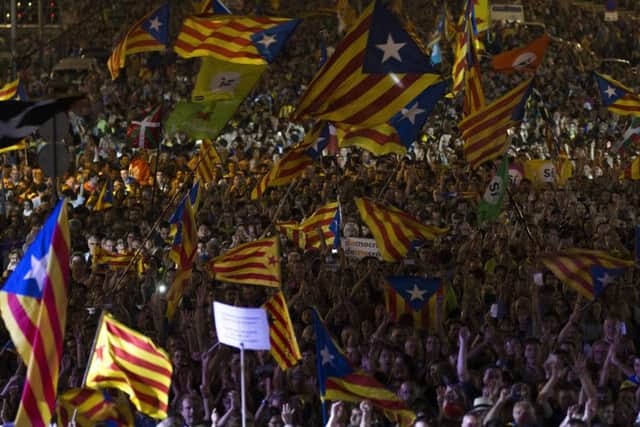 Thousands cheer and wave esteleda, or Catalonia independence flags, during the 'Yes' vote closing campaign in Barcelona, Spain, Friday, Sept. 29, 2017. Catalonia's planned referendum on secession is due be held Sunday by the pro-independence Catalan government but Spain's government calls the vote illegal, since it violates the constitution, and the country's Constitutional Court has ordered it suspended. (AP Photo/Francisco Seco)