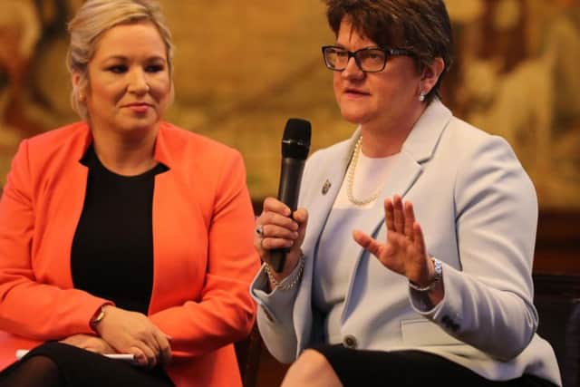 DUP leader Arlene Foster and Sinn Fein's Northern Ireland leader Michelle O'Neill attend the Ulster fry breakfast at Manchester Town Hall during the Conservative Party Conference at the Manchester Central Convention Complex in Manchester