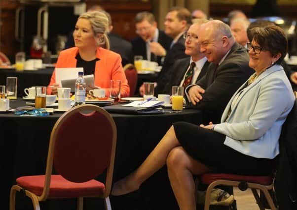 Sinn Fein's Stormont leader Michelle O'Neill, left, at the Ulster fry breakfast at Manchester Town Hall on Tuesday with others including DUP leader Arlene Foster, right, during the Conservative Party Conference at the Manchester Central Convention Complex in Manchester. Photo: Owen Humphreys/PA Wire