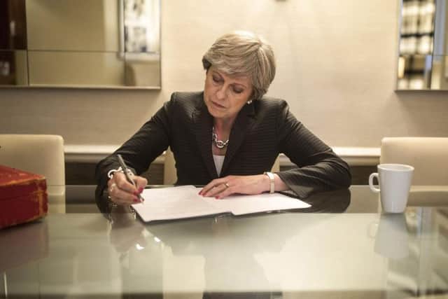 Prime Minister Theresa May prepares her speech.